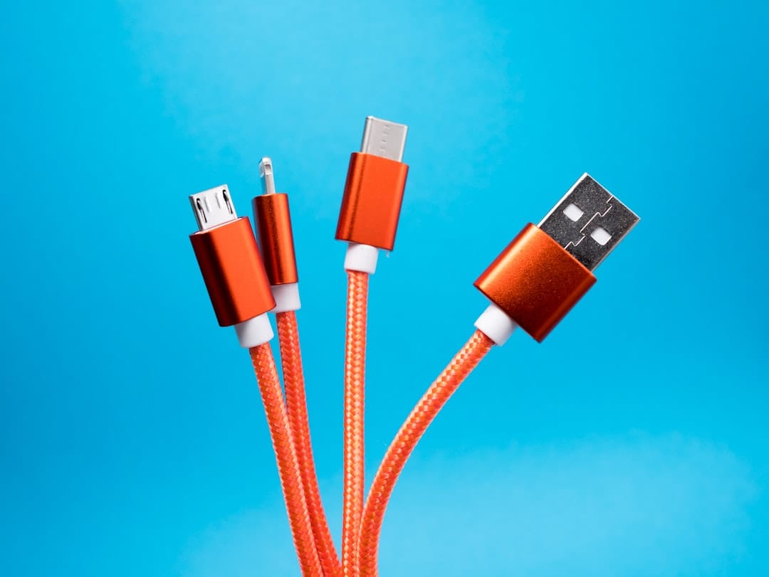 Coiled orange USB charging cables — illustrating the consumer charging accessory category